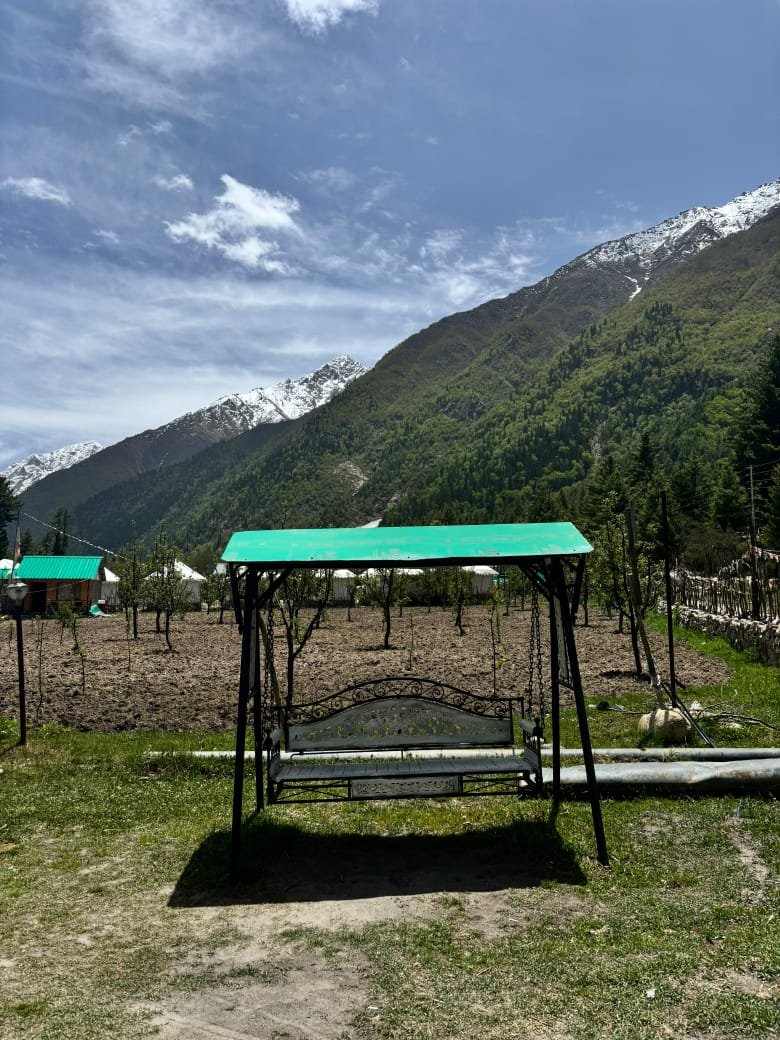 Garden swing with Himalayan peaks in the background